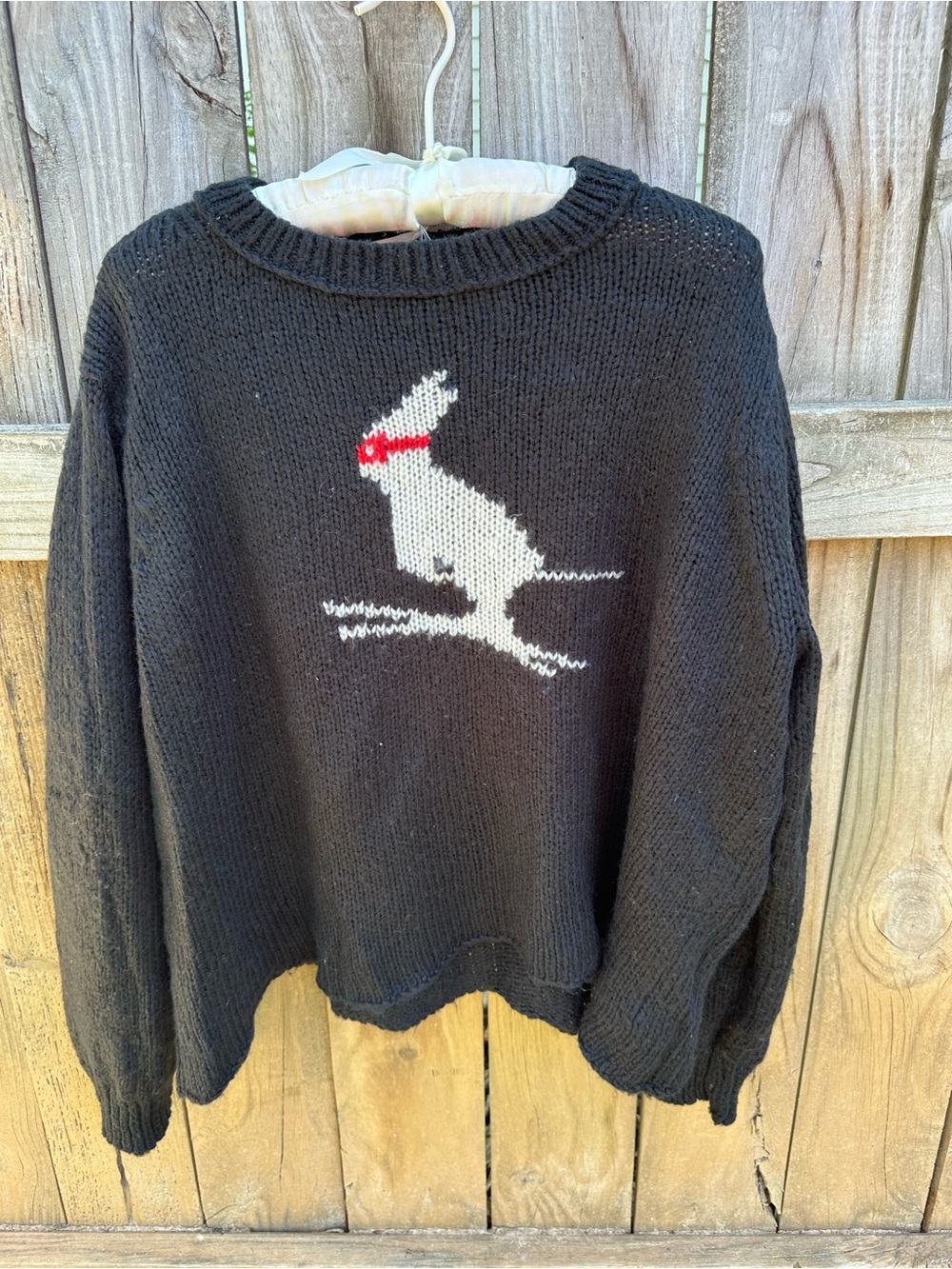Wooden Ships black sweater with a rabbit skiing